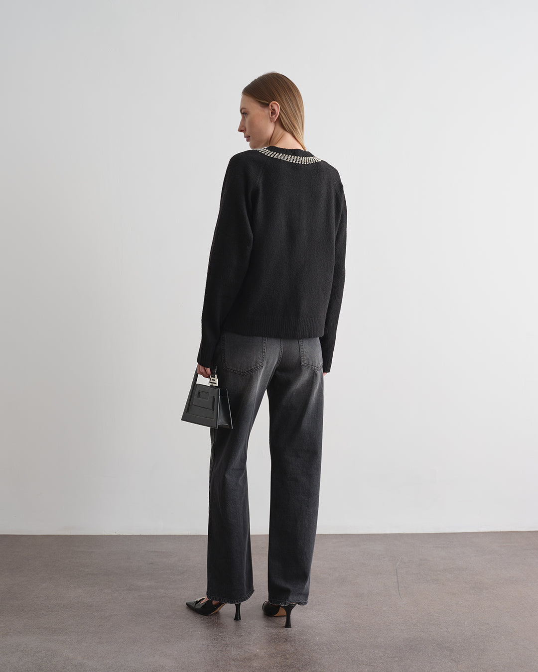 Pantalone in denim con strass all over