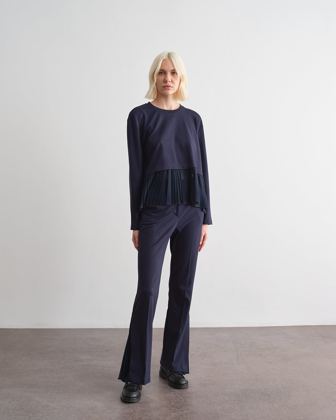 Blusa con inserti in plissè