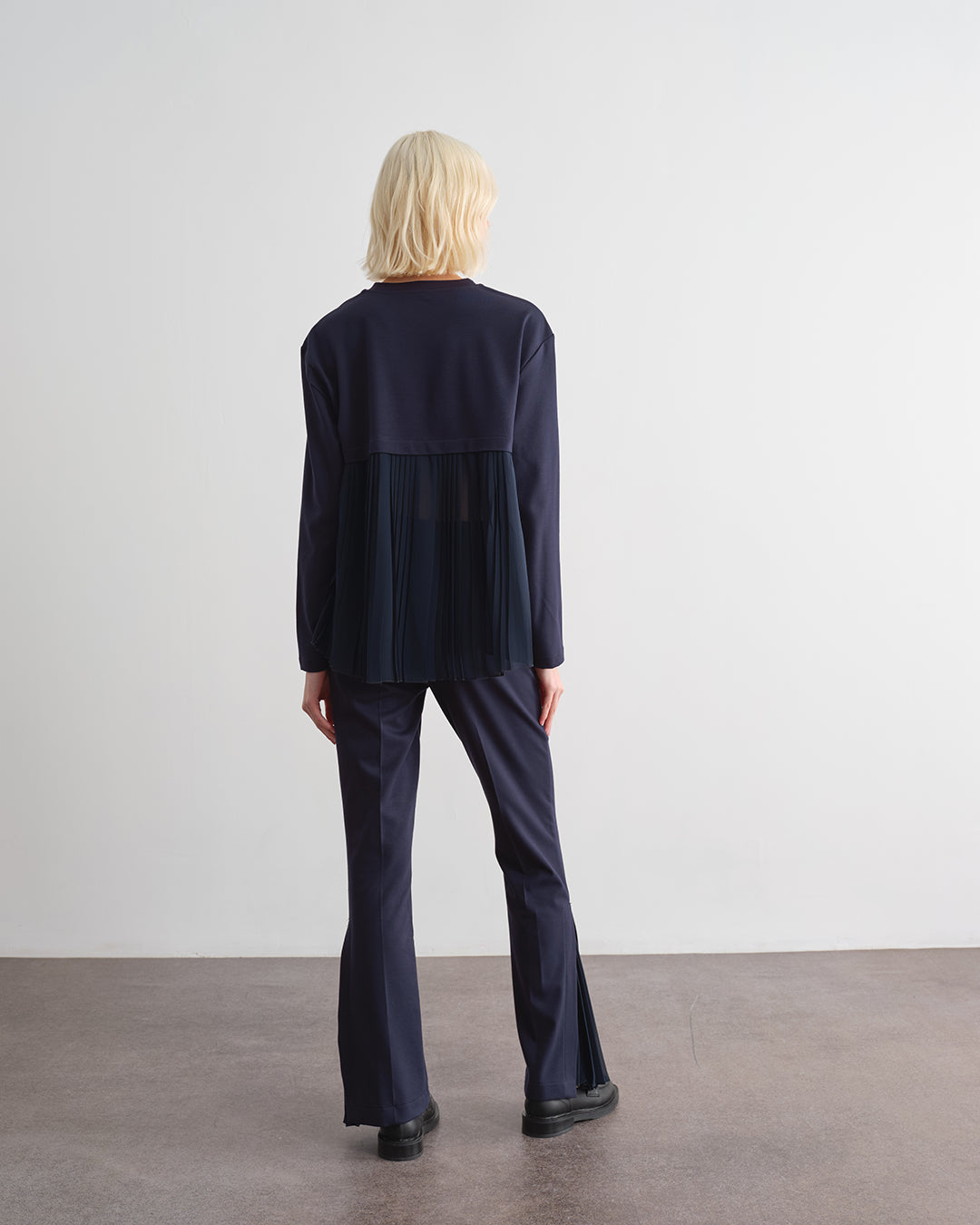 Blusa con inserti in plissè